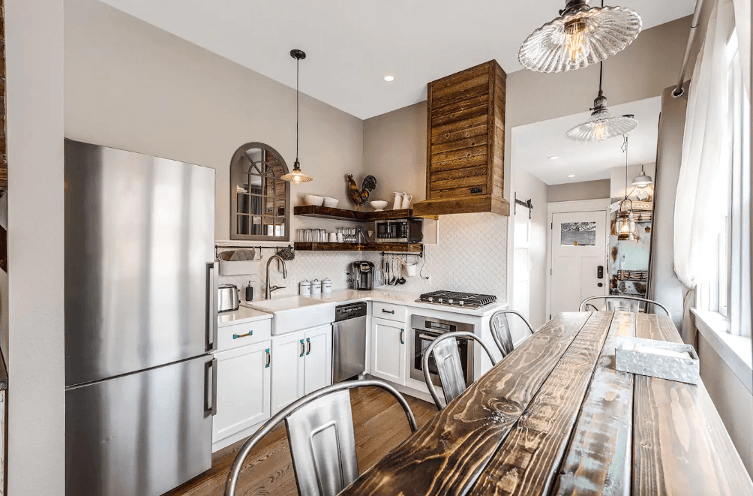 The Aggie House in Louisville offers a modern kitchen with stainless-steel appliances