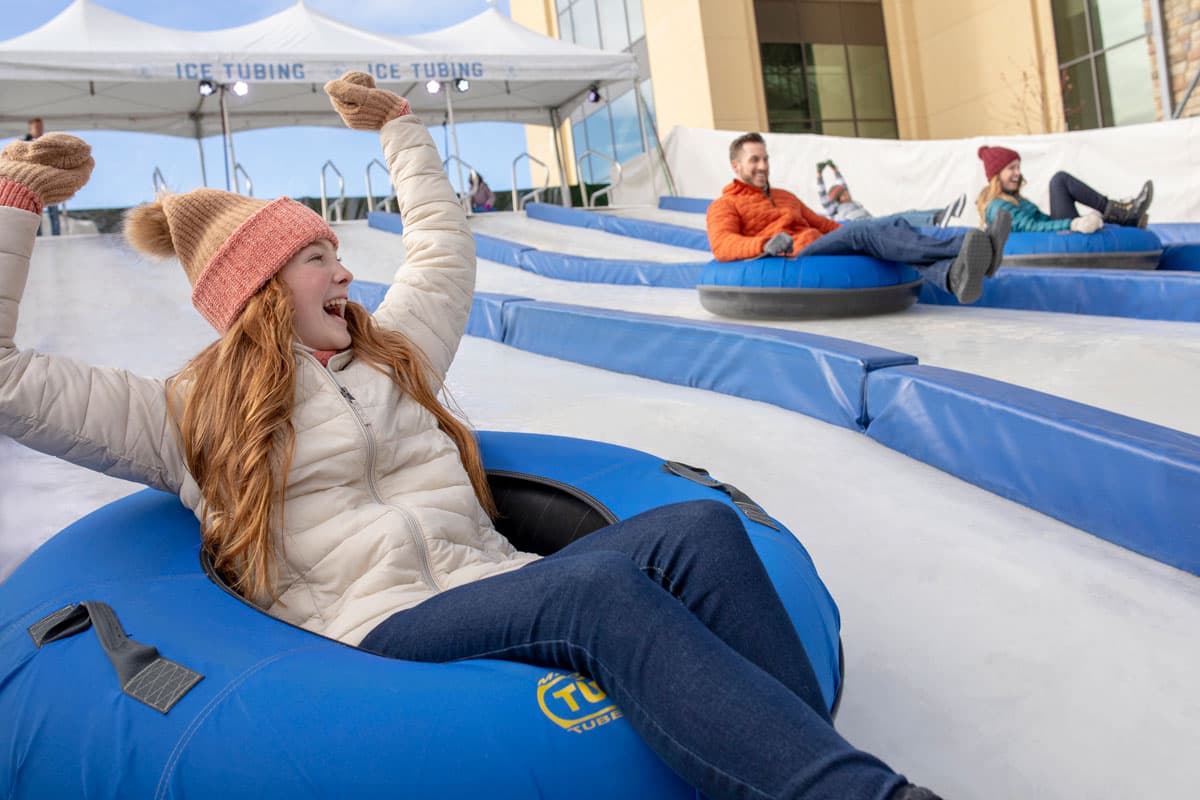 A family snow tubes at Gaylord Rockies Resort & Convention Center