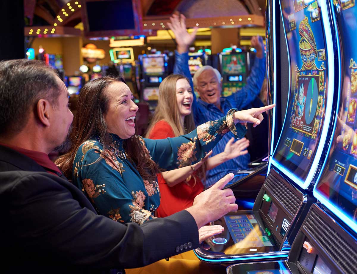 A group of people play slots at Sky Ute Casino Resort