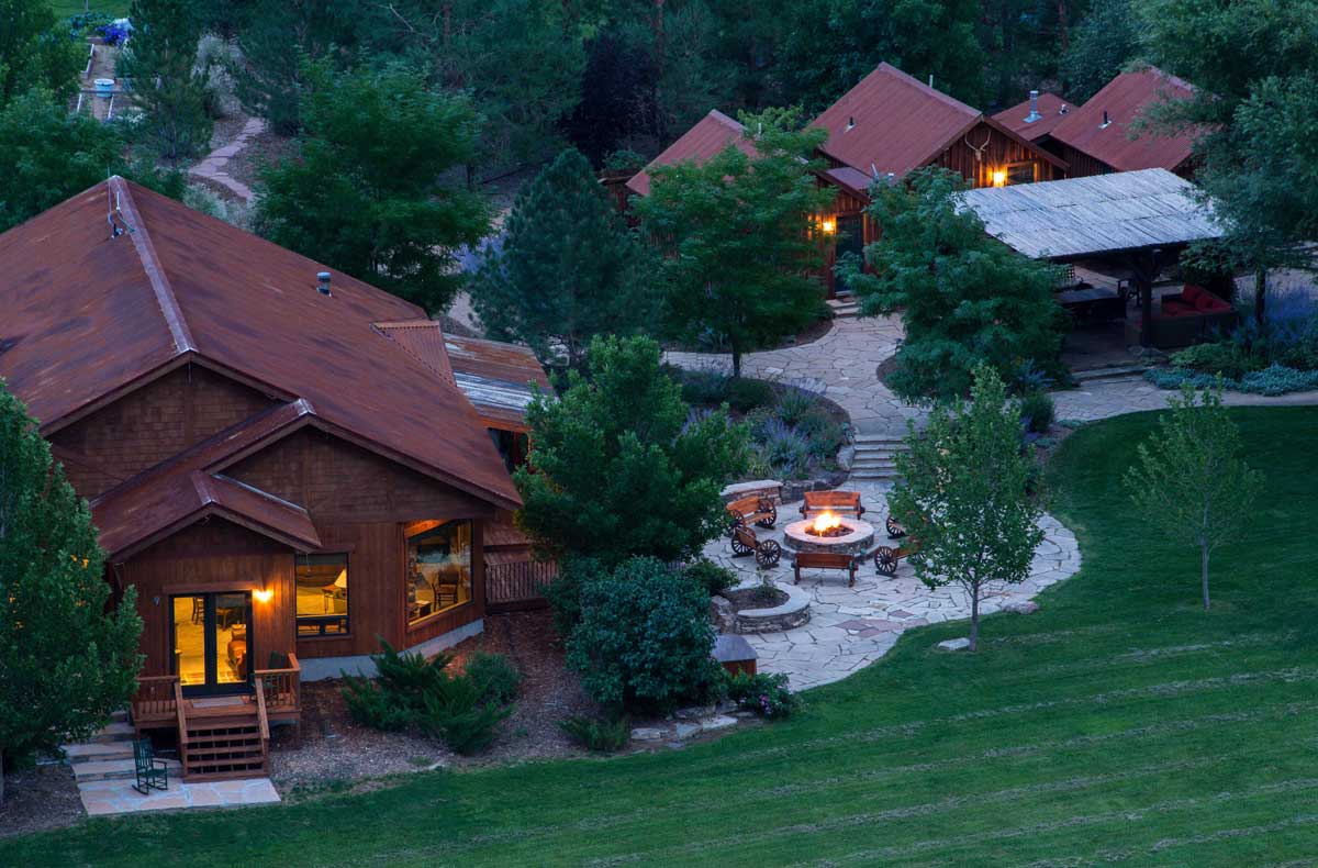 Exterior of Gunnison River Farms lodgings seen at dusk