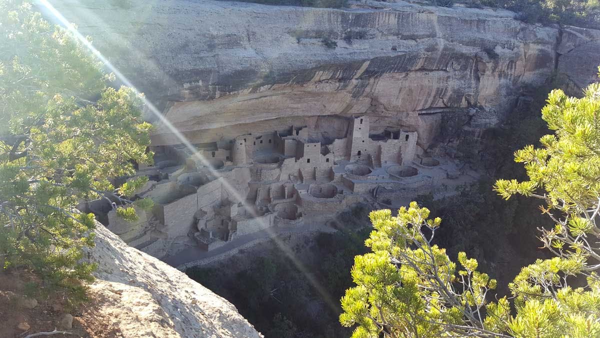 Cave dwellings are carved into a large rock face