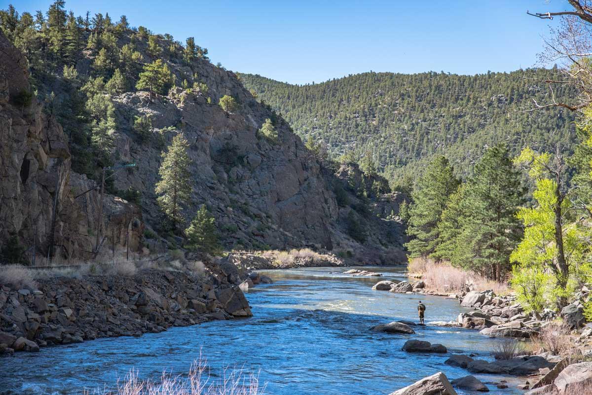 A fisher tries their luck along the banks of the Arkansas Headwaters Recreation Area in Colorado.