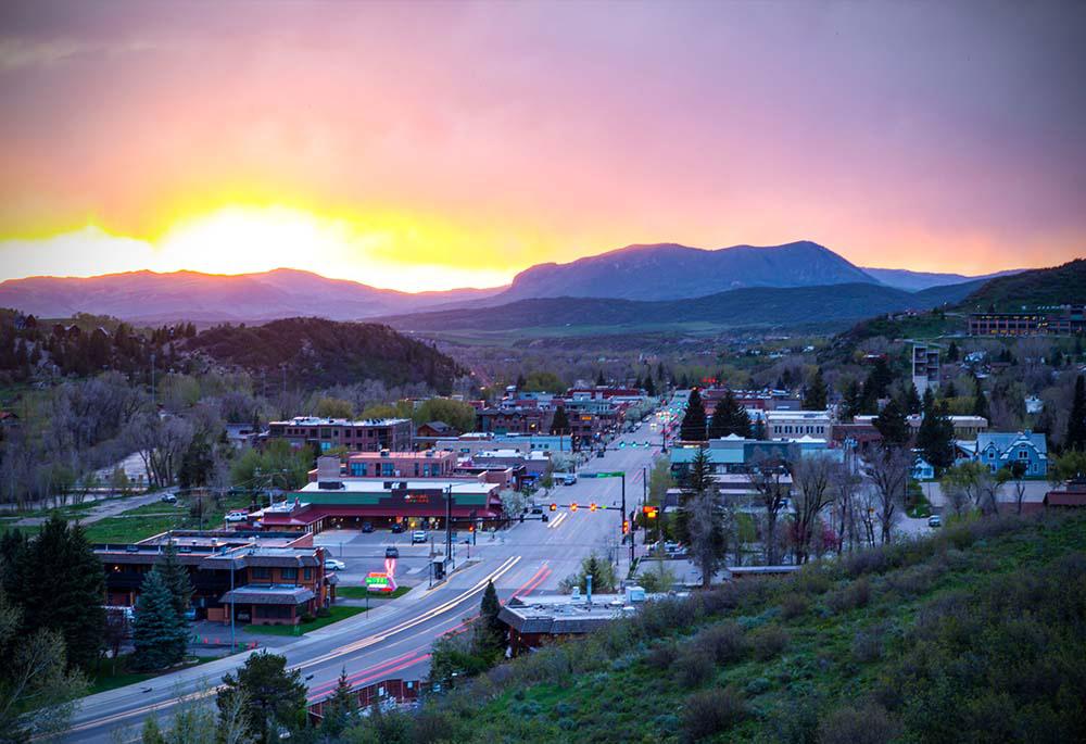 Aerial view of Steamboat Springs, including the highway running through the middle of town, the Rabbit Ears Motel and other businesses