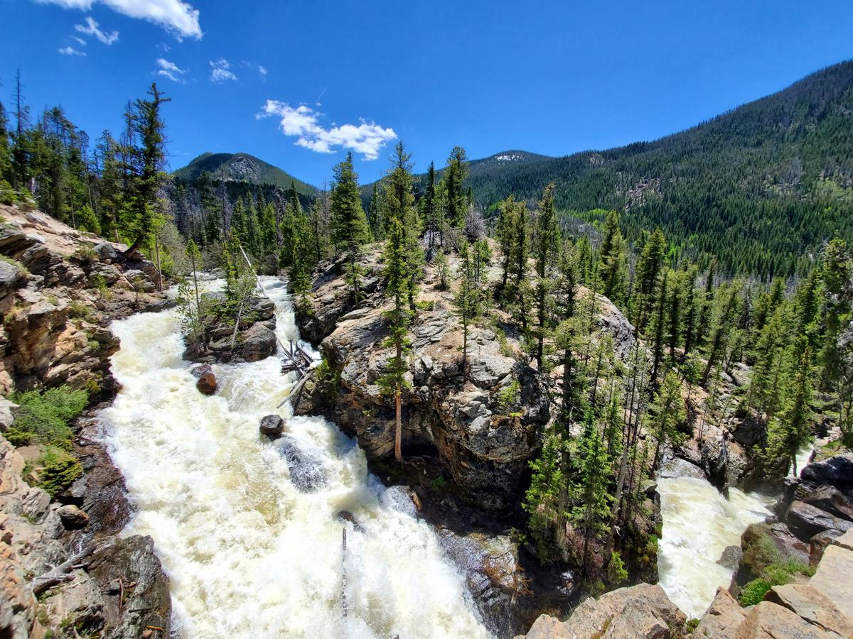 Whitewater rushes over rocks at the Adams Falls on East Inlet Trail in Rocky Mountain National Park in Colorado.