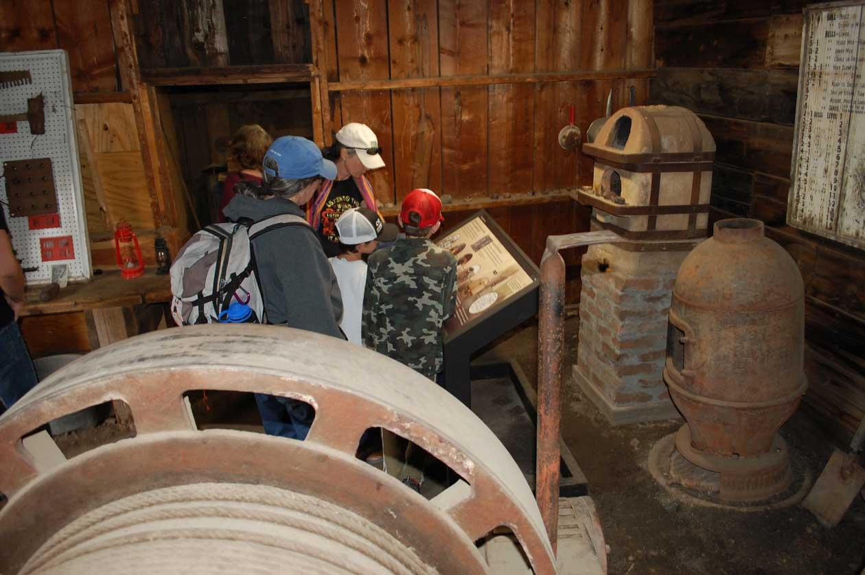 A group on a tour of mining equipment