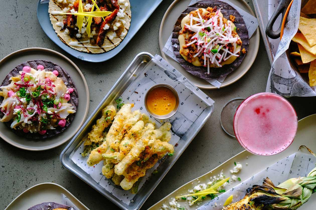 A table with colorful plages of food