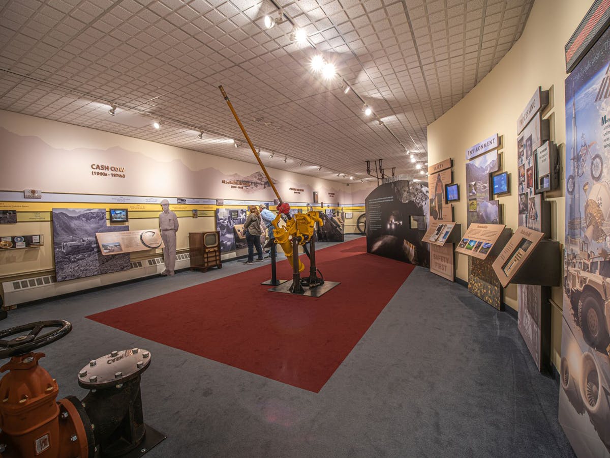 A room with artifacts and exhibits spread around it, all focused on the mineral molybdenum,  at Leadville's National Mining Hall of Fame & Museum