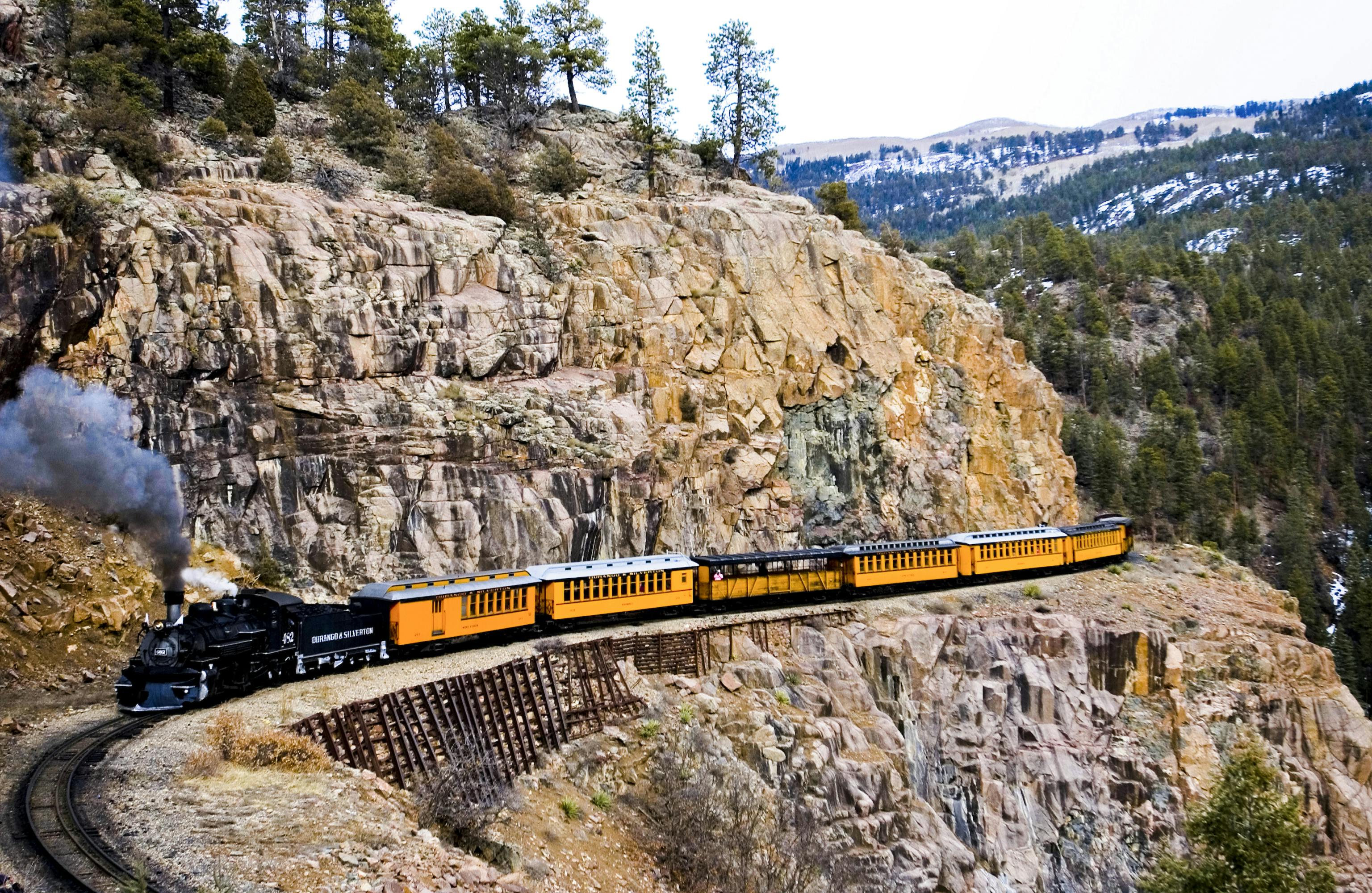 A plume of smoke erupts from the Durango and Silverton Narrow Gauge Railroad as it snakes through Southwest Colorado.