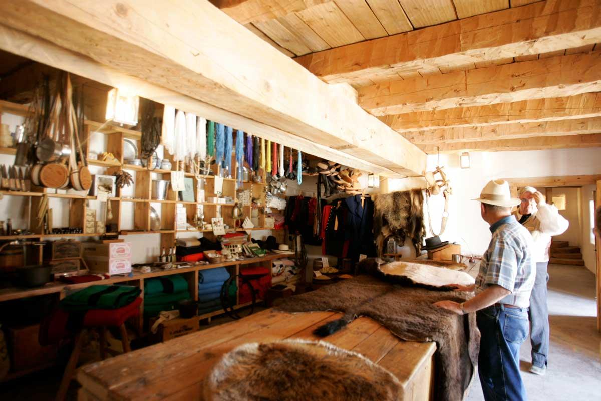 People admire animal skins at Bent's Old Fort near La Junta