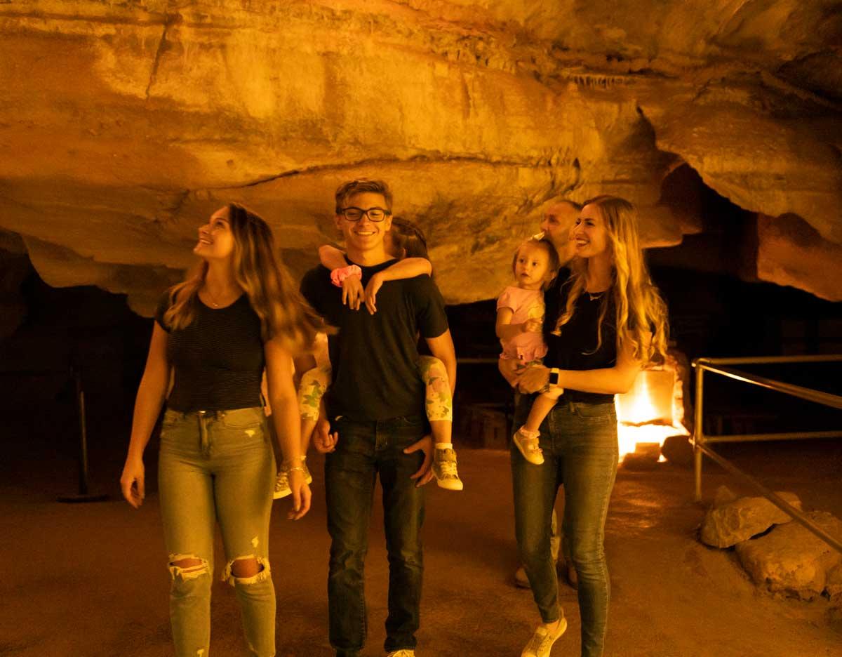 A group of people look up in amazement at Cave of the Winds in Manitou Springs