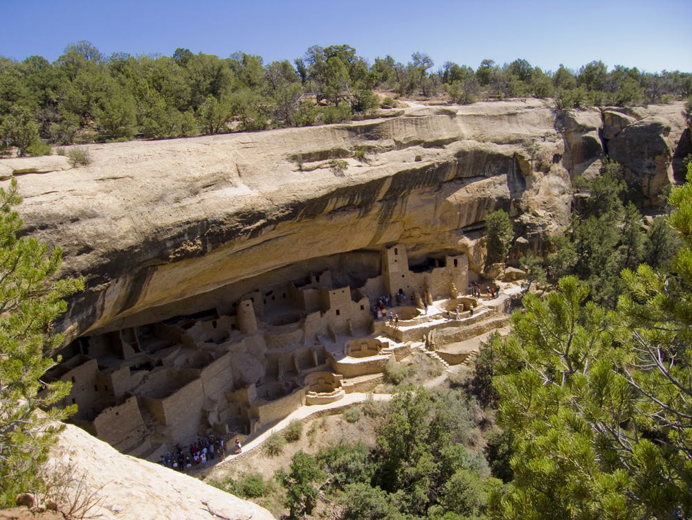 Group tours explore the ancient cave dwellings at Mesa Verde National Park in Colorado.