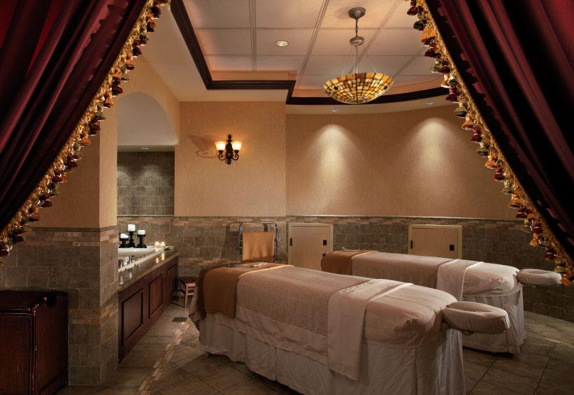 Massage tables inside an ornate spa treatment room