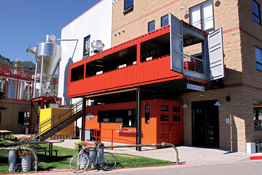 Outdoor seating area at The Container Restaurant at Ska Brewing Company in Durango on a sunny day