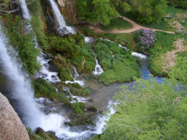 Several waterfalls rush down a mountain