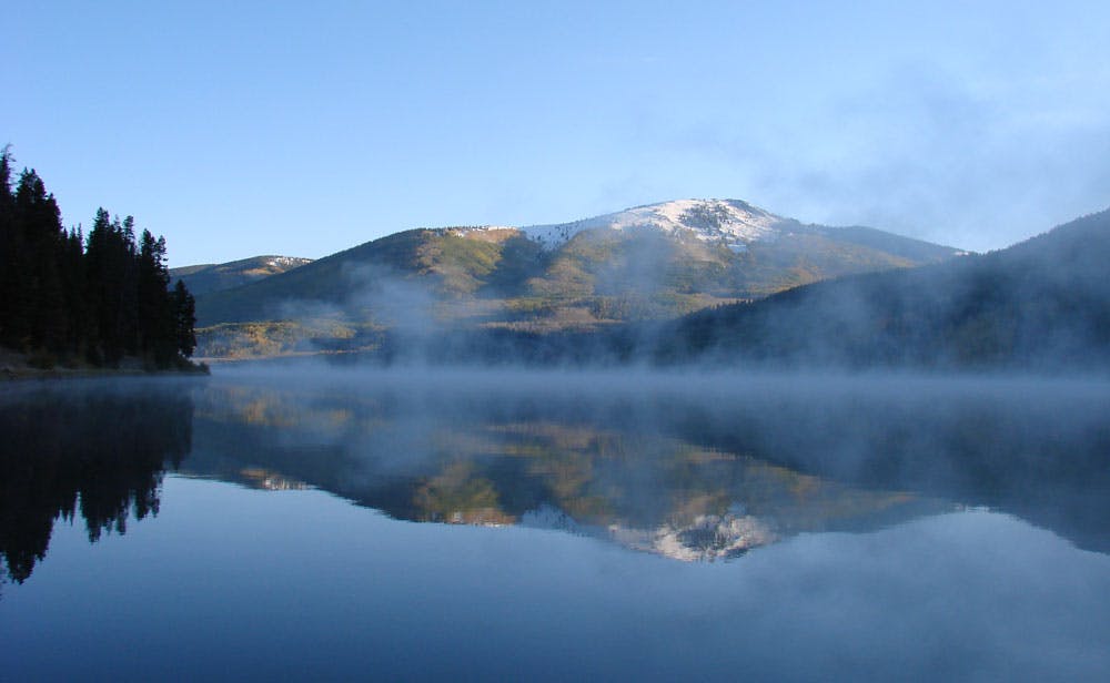 Still lake with the reflection of a mountain