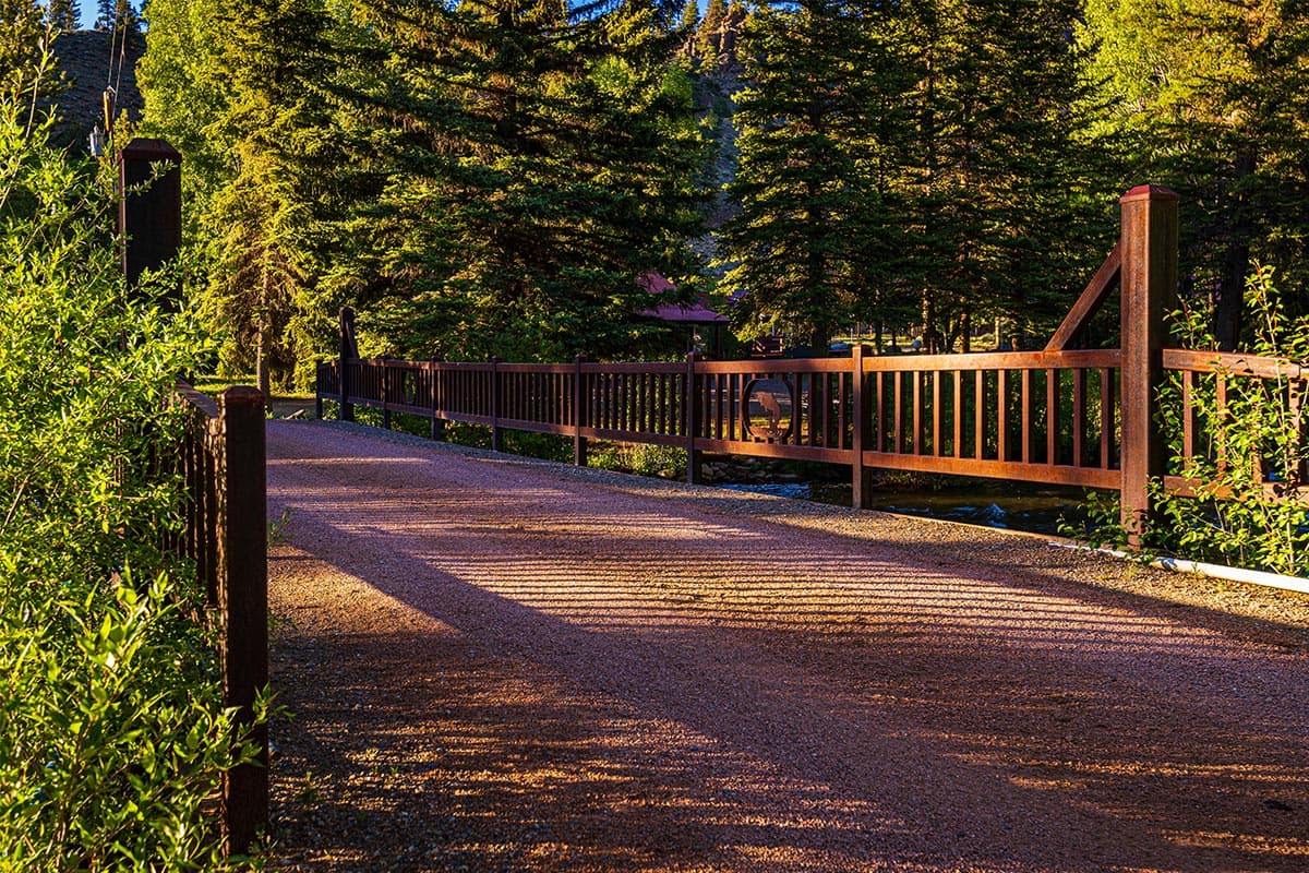 A bridge allows adventurers and vehicles to pass through. The bridge has a decorative fish design in the middle of the railing.