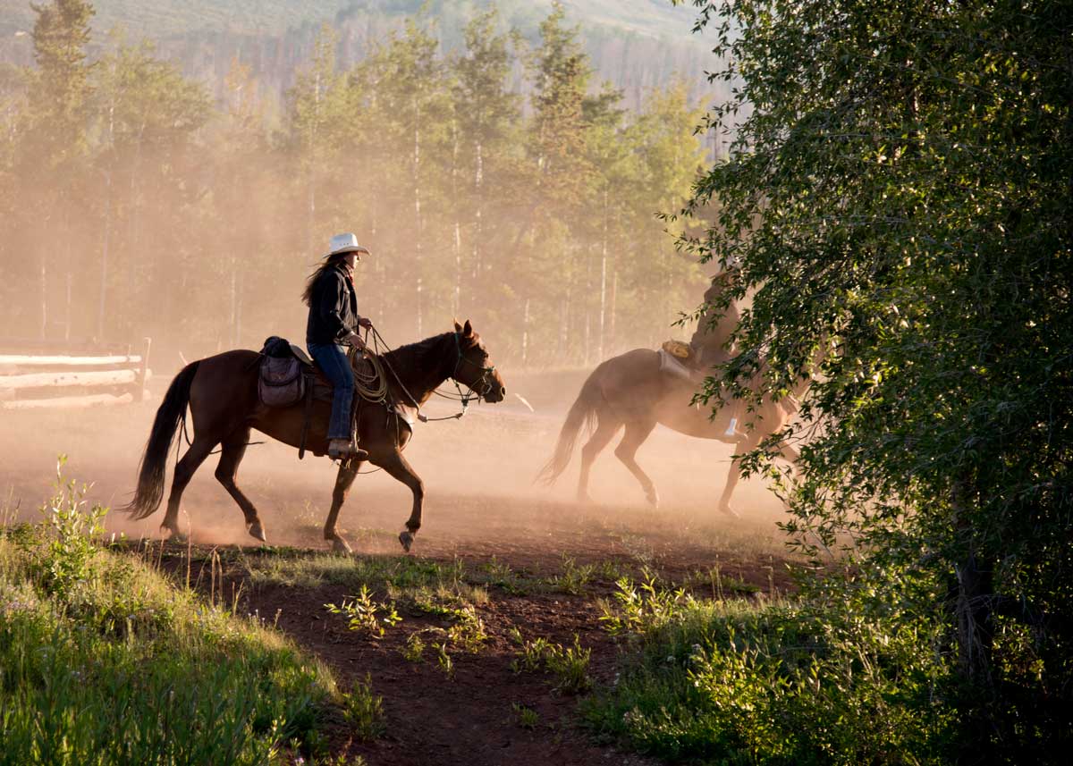 Guests ride horses at Latigo Ranch in Colorado