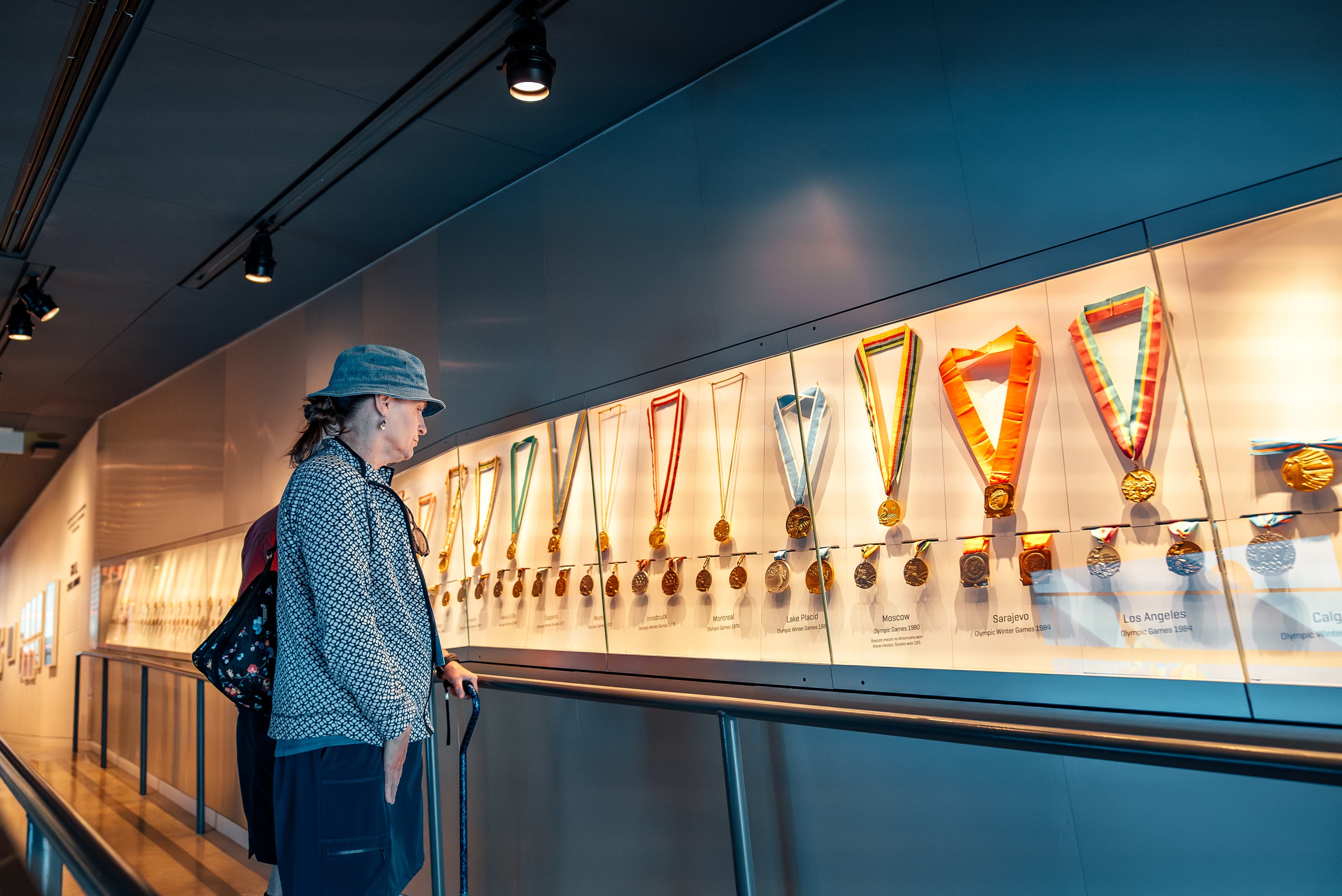 A person admires the US Olympic & Paralympic Museum medals display in Colorado Springs