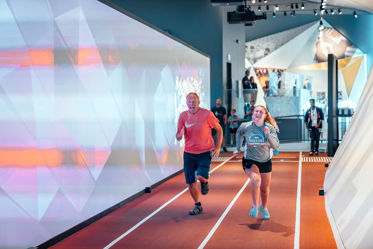 Dad and daughter racing on track at the U.S. Olympic & Paralympic Museum  in Colorado Springs