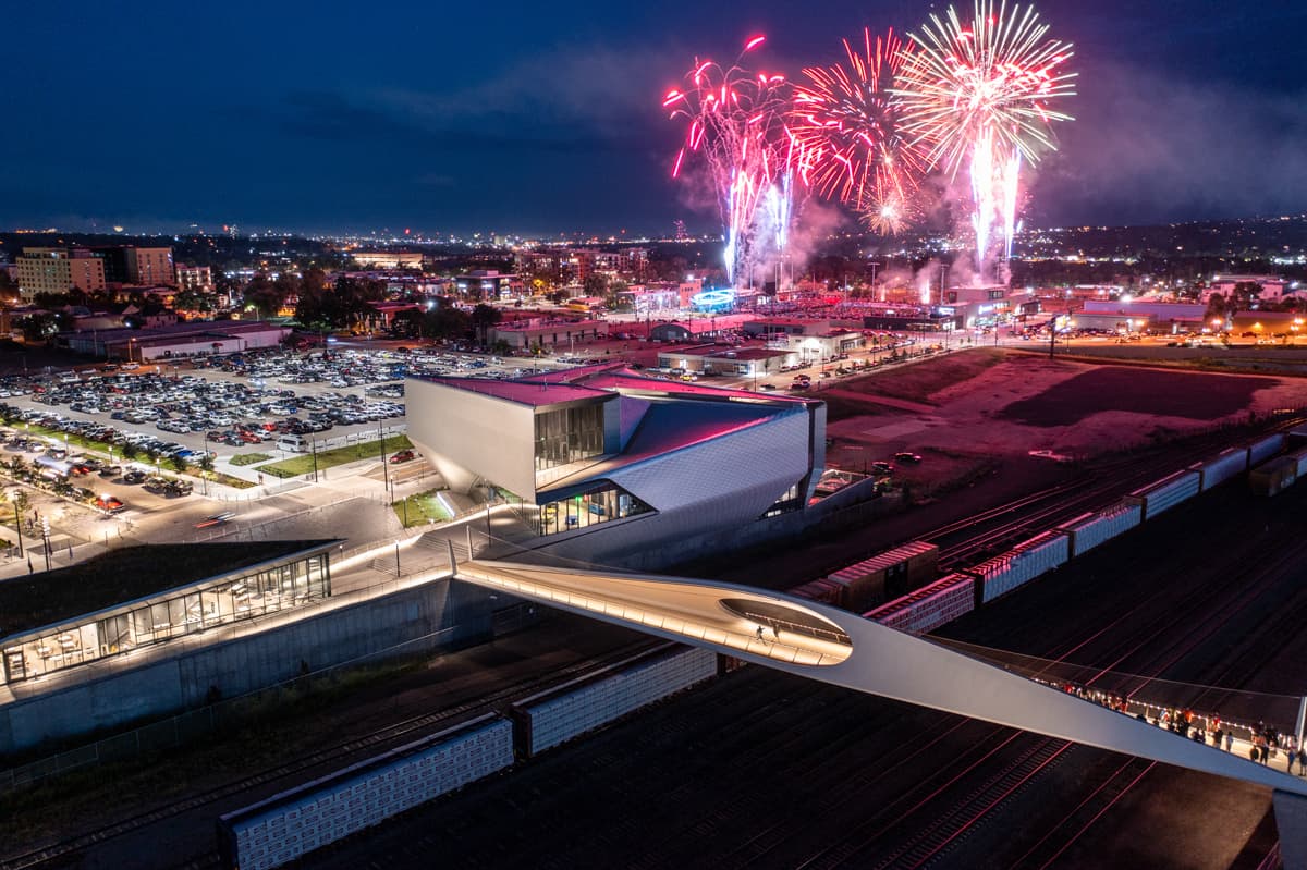 An aerial shot of fireworks going off behind the U.S. Olympic & Paralympic Museum in Colorado Springs