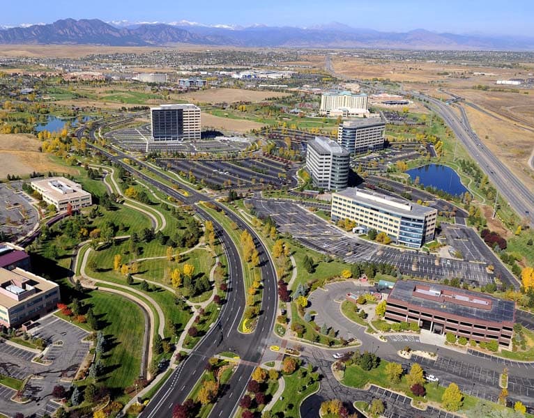 An aerial shot of Broomfield in the summer with office buildings and freshly paved roads.