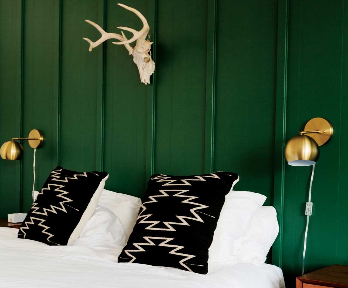 Interior of a hotel room with pillows and decorations