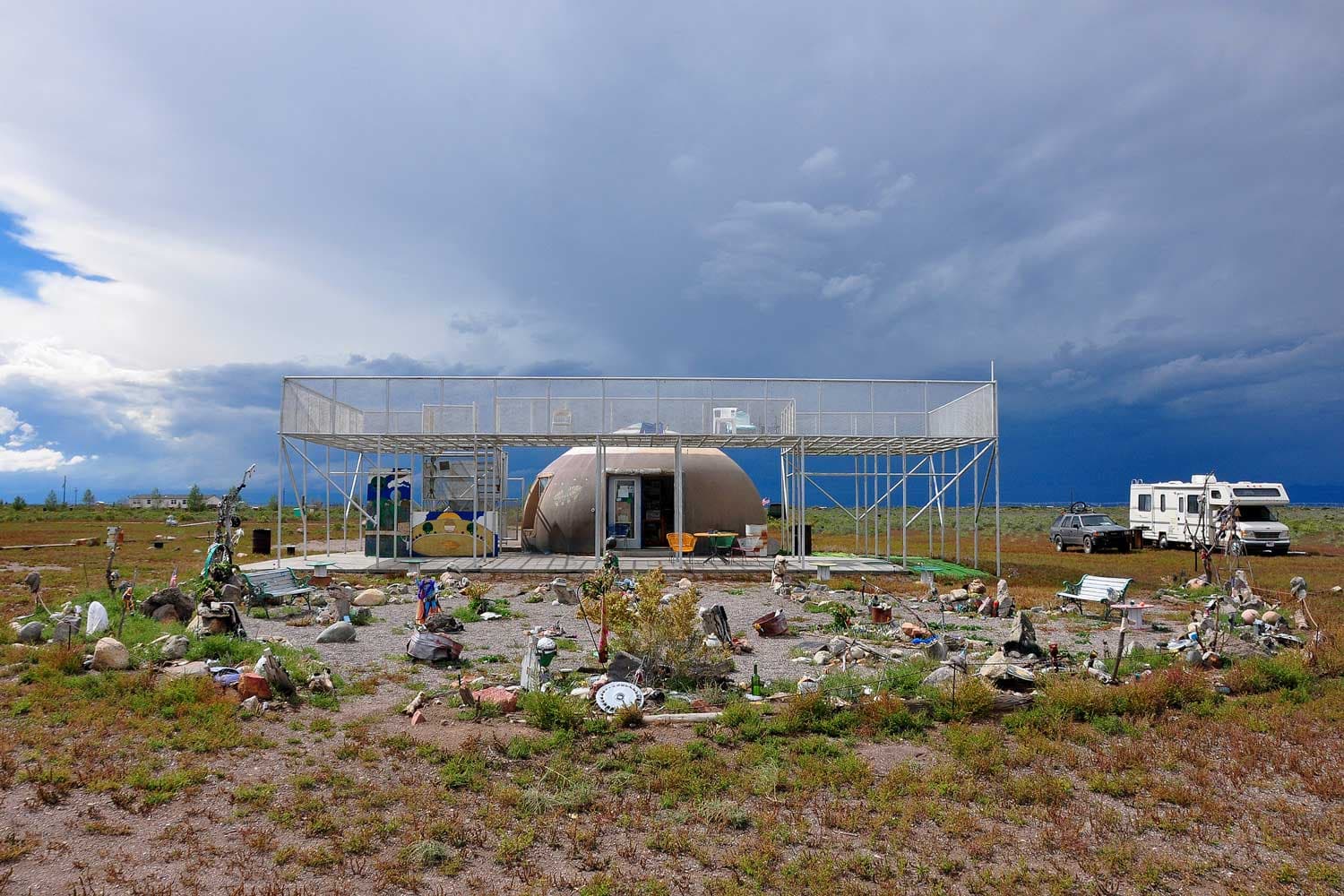 The UFO Watchtower viewing platform surrounded by trinkets on a cloudy day