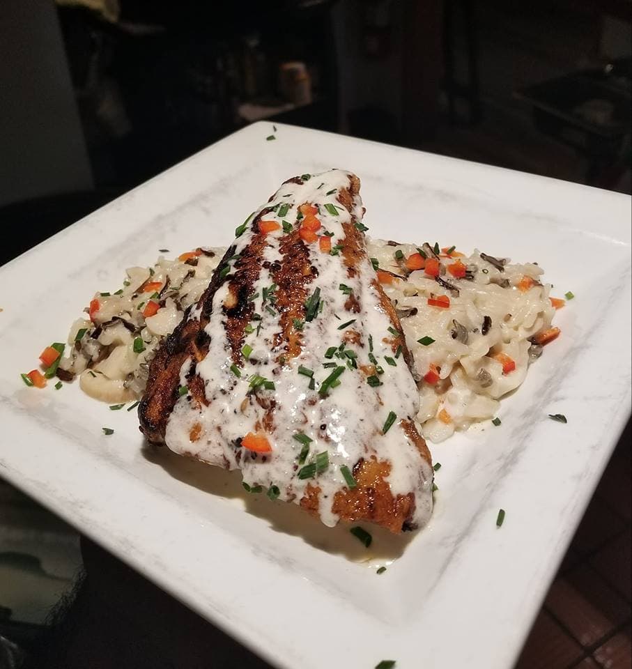pan-seared salmon at 4th & main downtown grille in wray photo